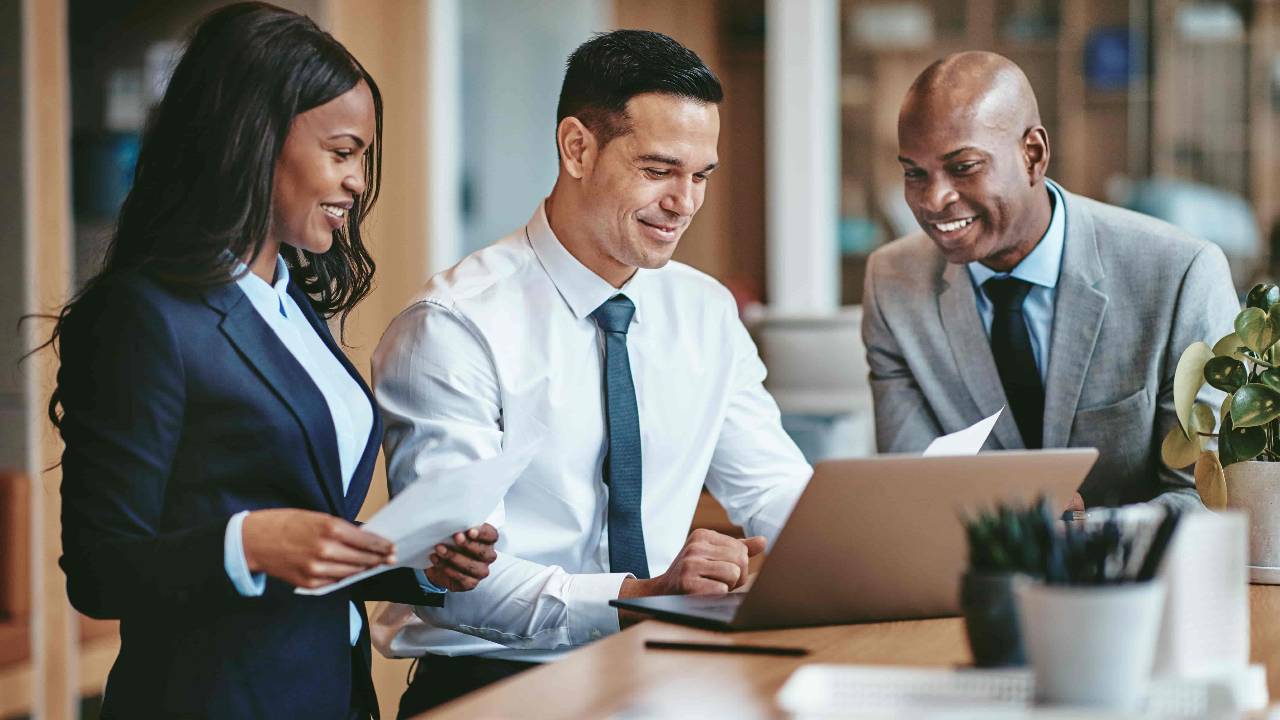 Diverse group of smiling businesspeople working in an office