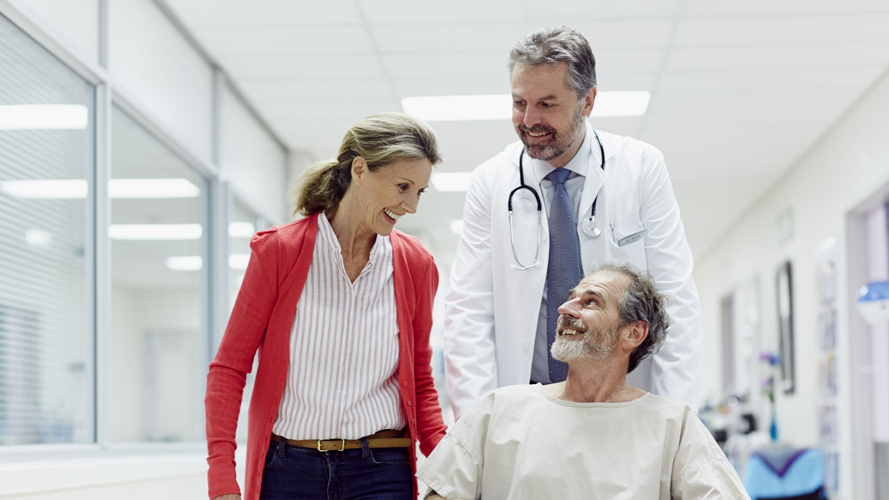 Doctor assisting his patient