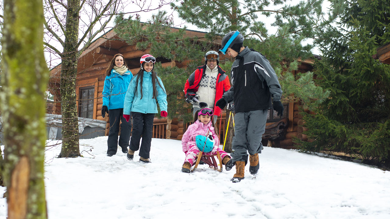 Happy family playing on the snow