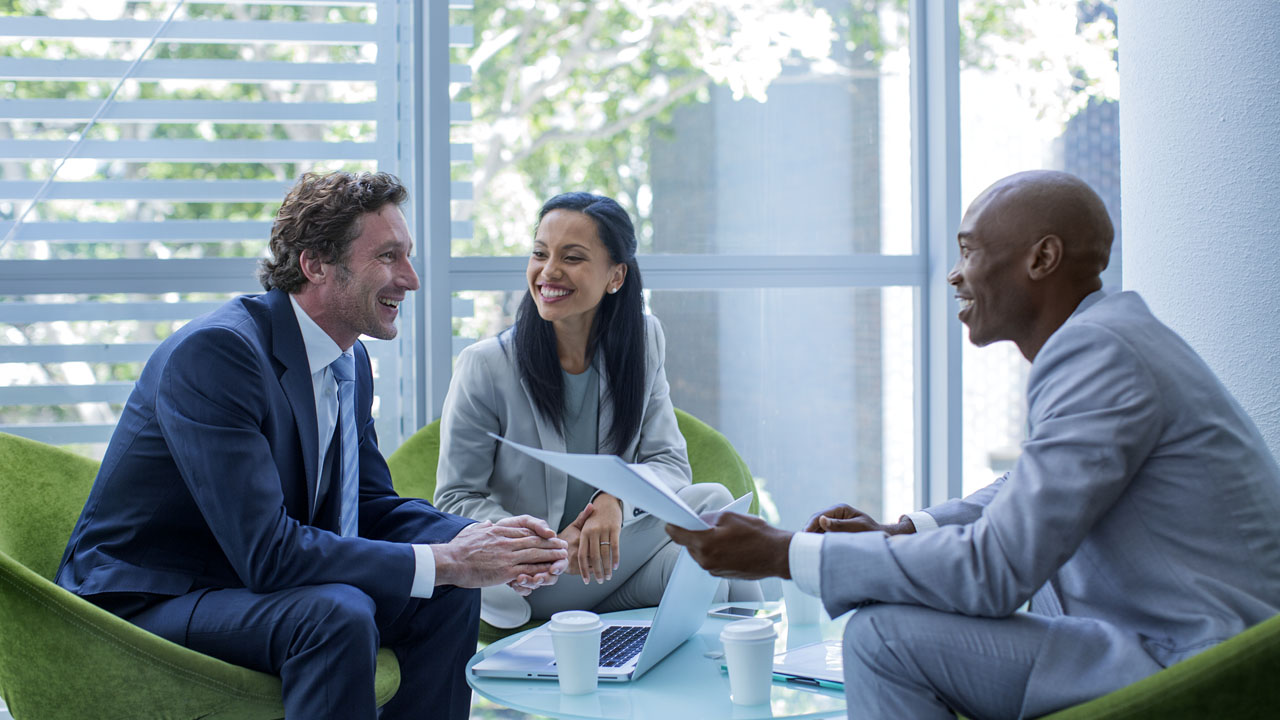 Three people having a conversation